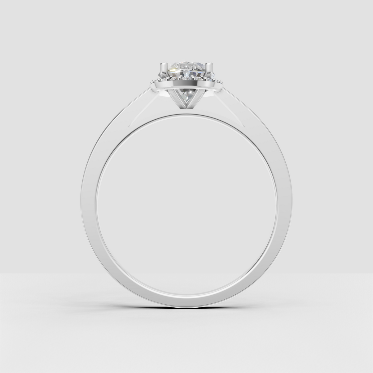 Yellow gold oval engagement ring with a classic diamond halo