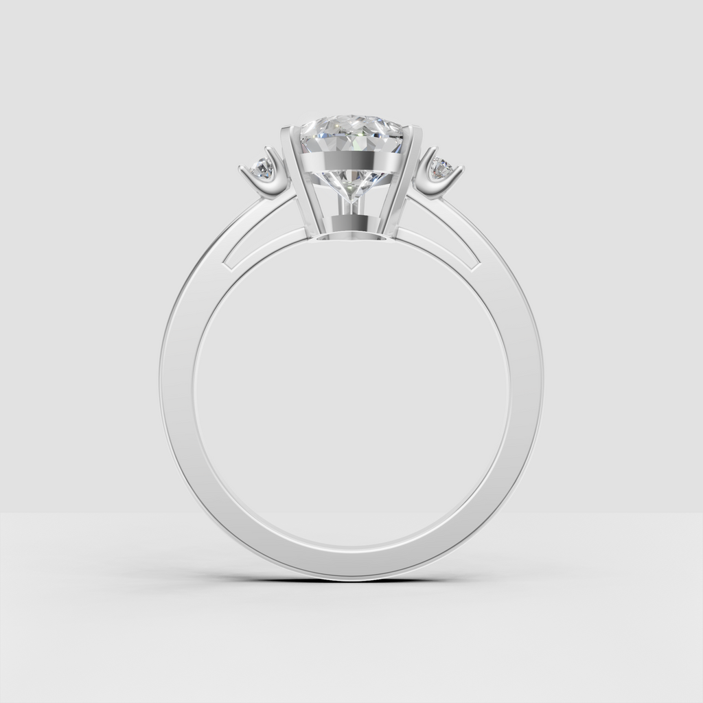 Pear shaped diamond ring with two round side diamonds