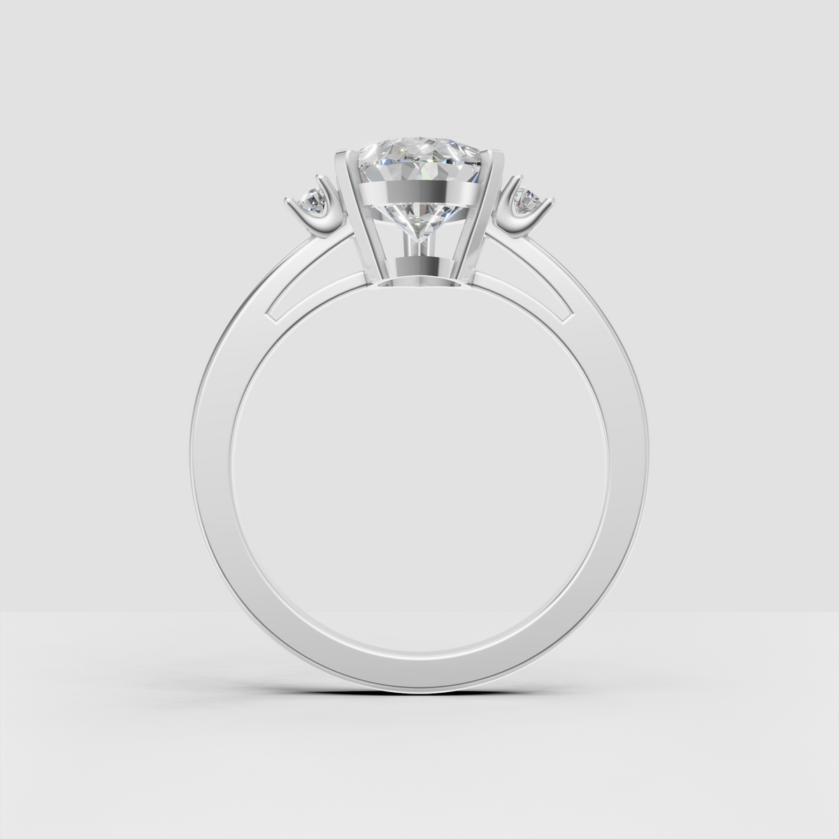 Pear shaped diamond ring with two round side diamonds