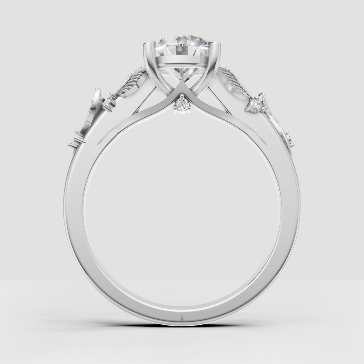 Nature inspired diamond ring with four-prong round center stone