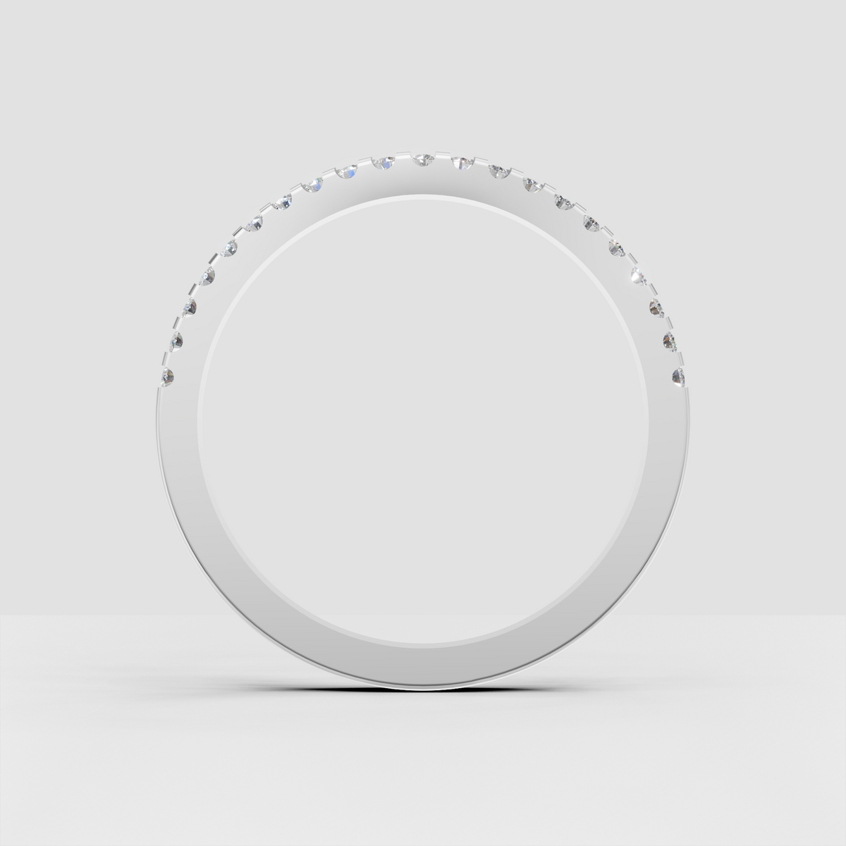 Slim yellow gold wedding band featuring round cut diamonds