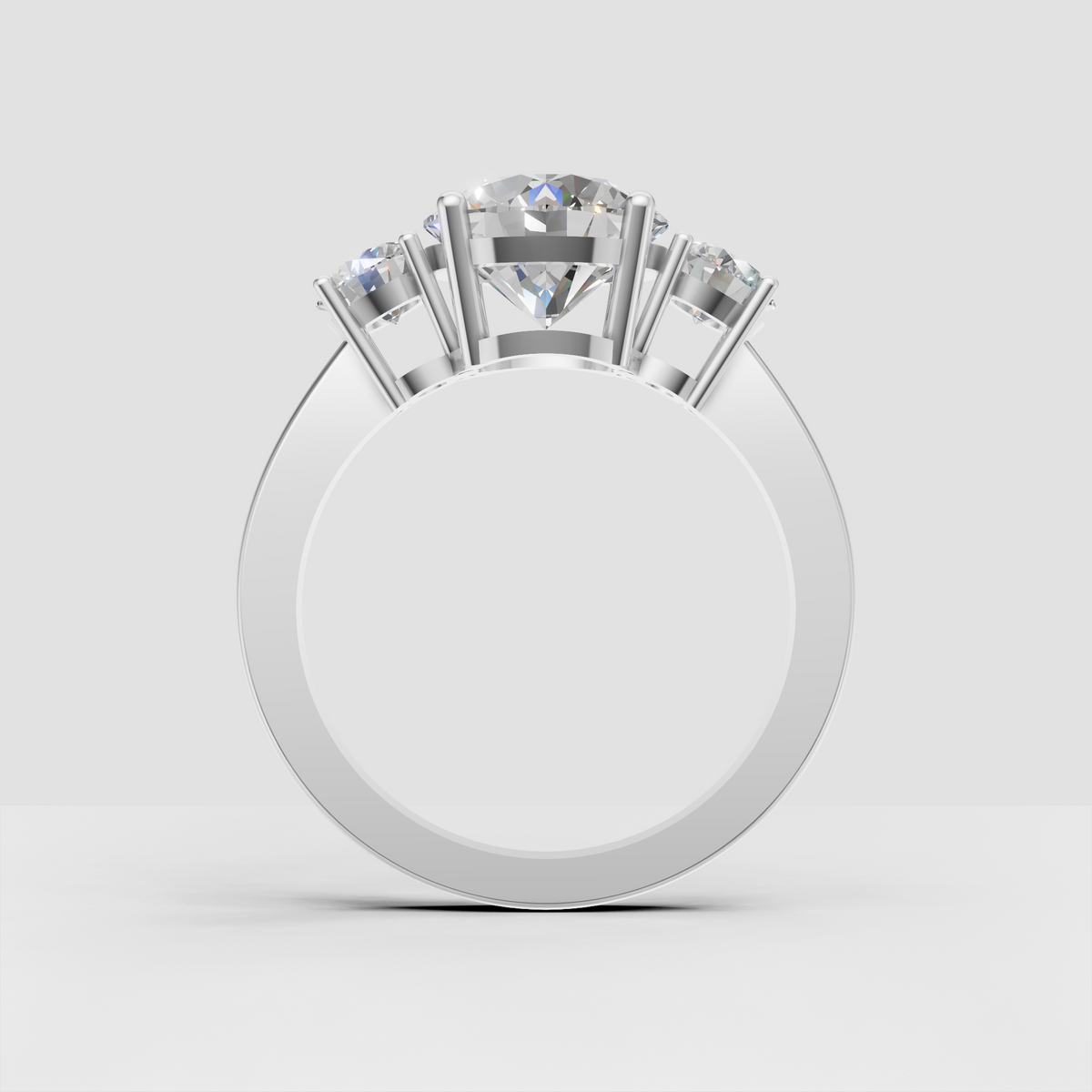 Three round diamond ring in polished yellow gold