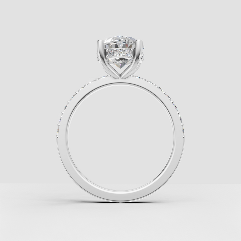 Classic oval cut bridal ring with pavé band and four prongs