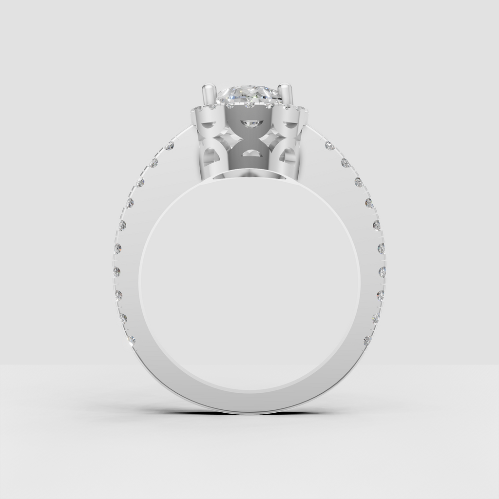 Pear shaped diamond halo engagement ring in polished metal