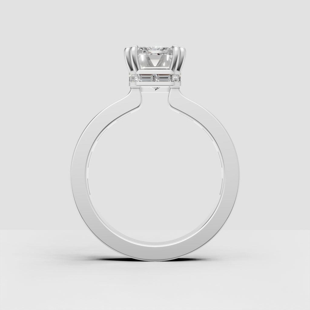 Elegant emerald cut ring in yellow gold with sleek baguette stone shoulders