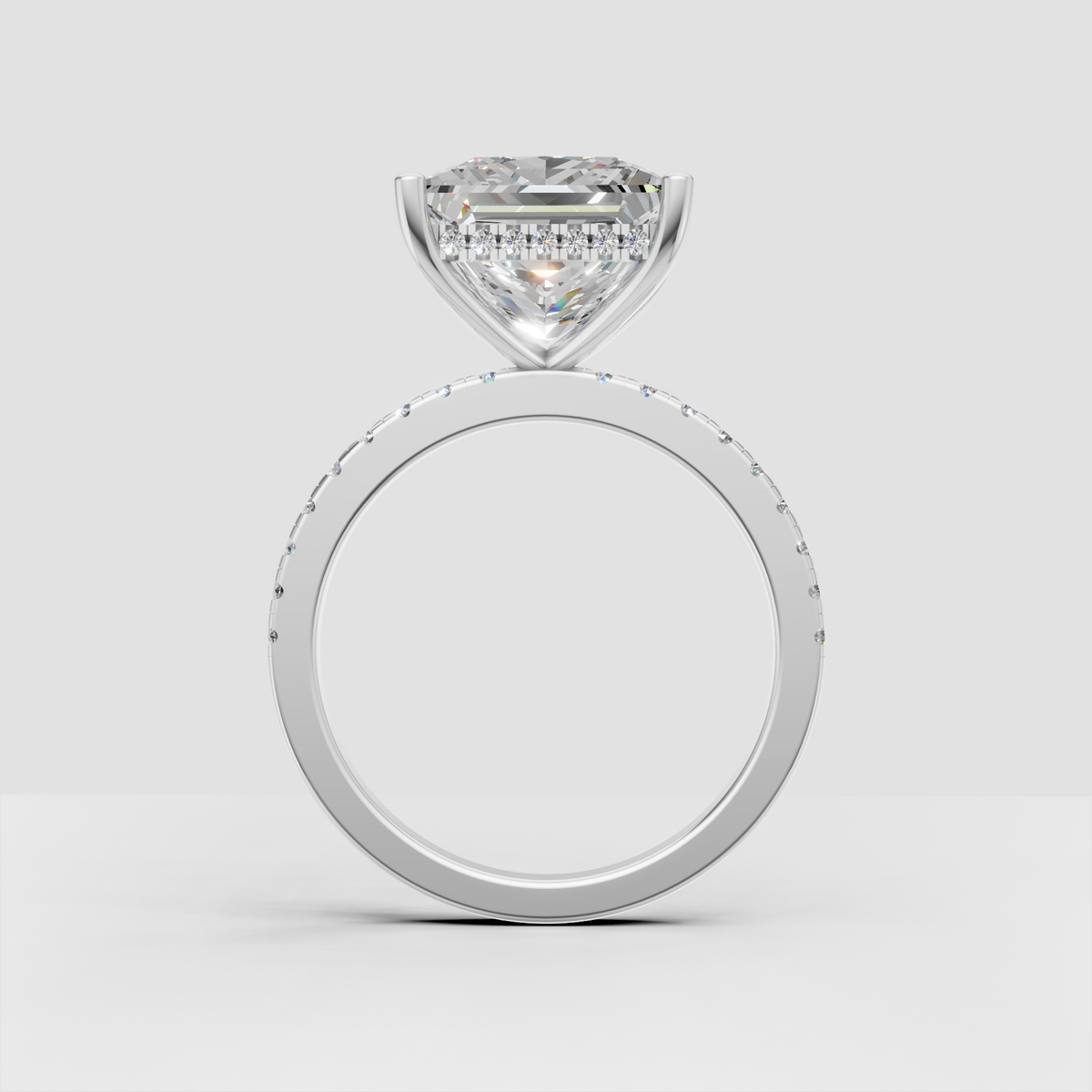 Classic princess cut diamond engagement ring with minimalist pavé shank.