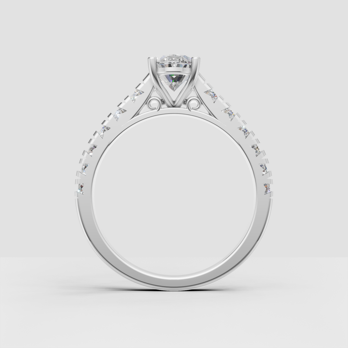 Oval diamond bridal ring with symmetrical pavé shoulders