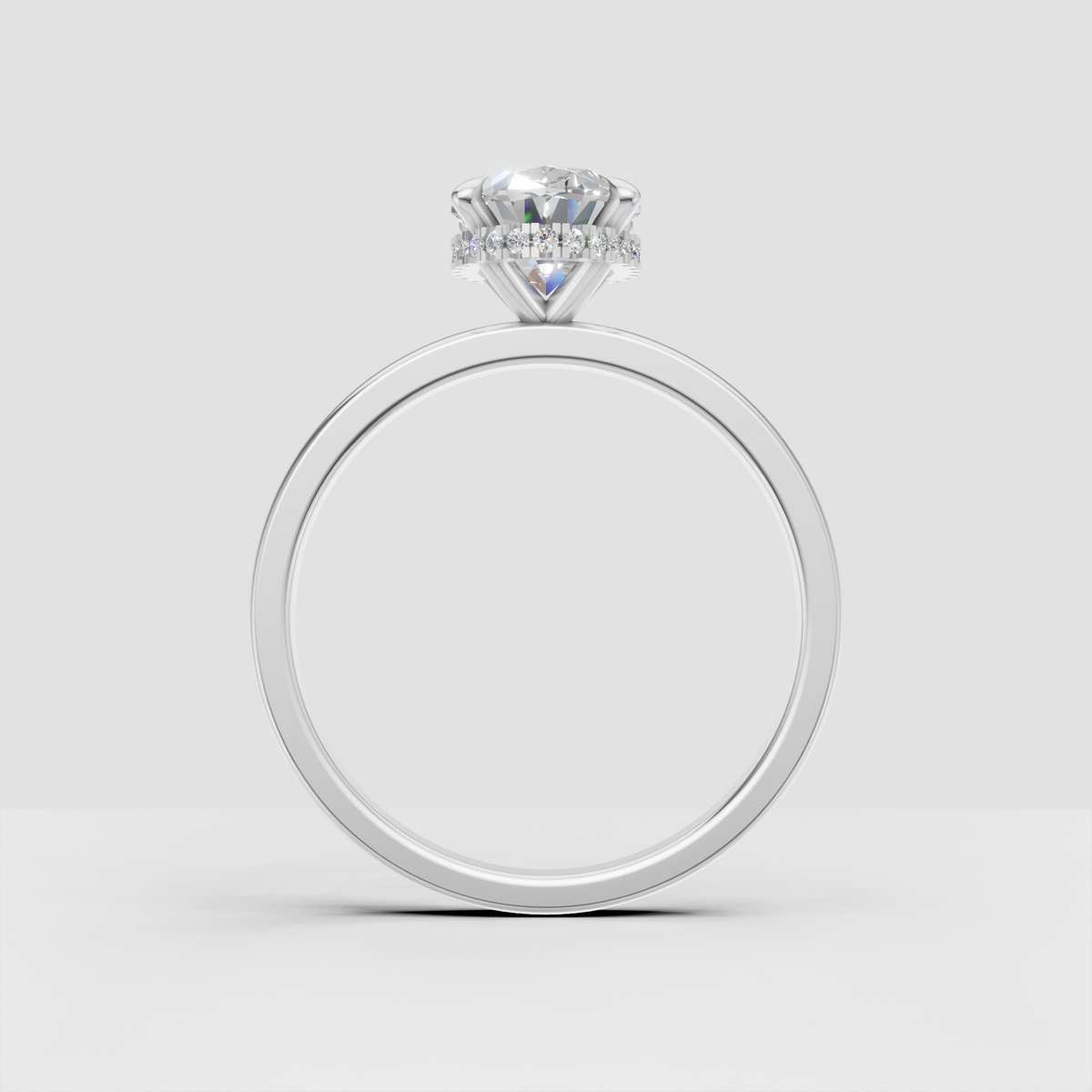 Classic oval diamond engagement ring with hidden halo