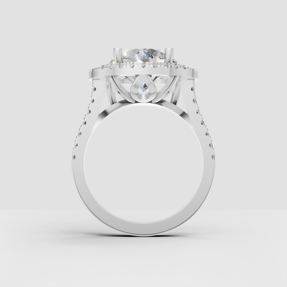 Round diamond engagement ring featuring double pavé halo setting