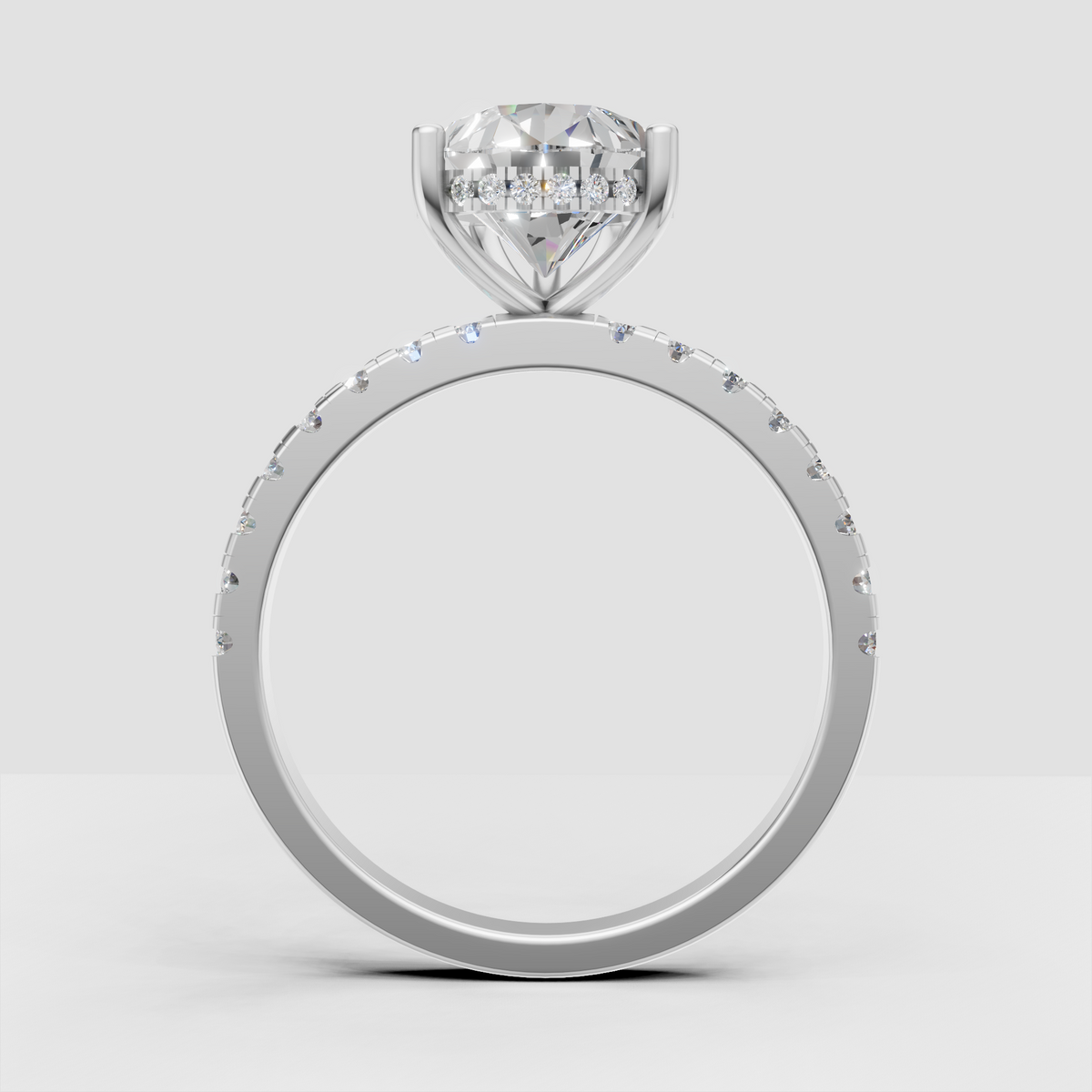 Pear Diamond engagement ring with elegant four-prong setting and pavé band