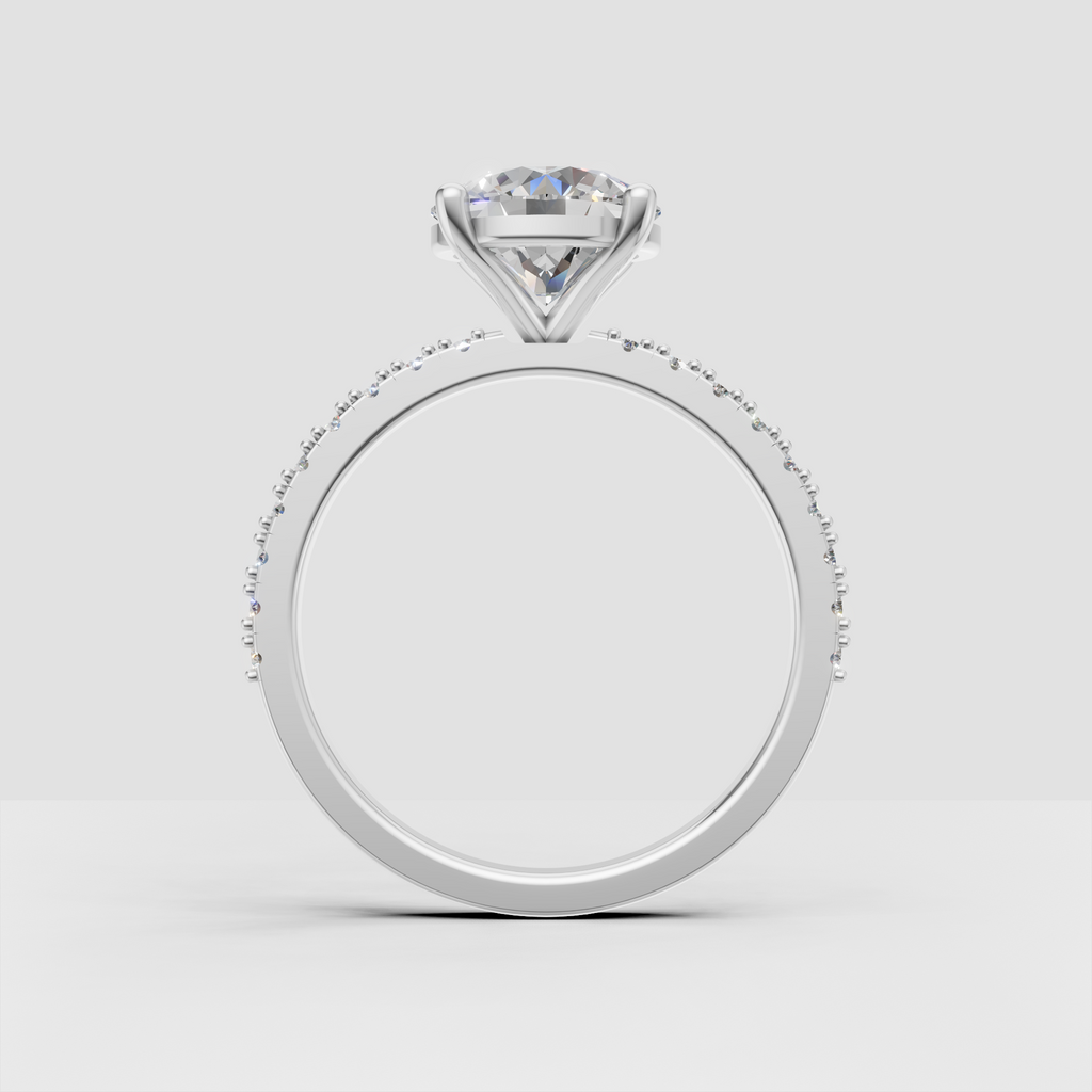 Round canter stone engagement ring with vintage pave detailing