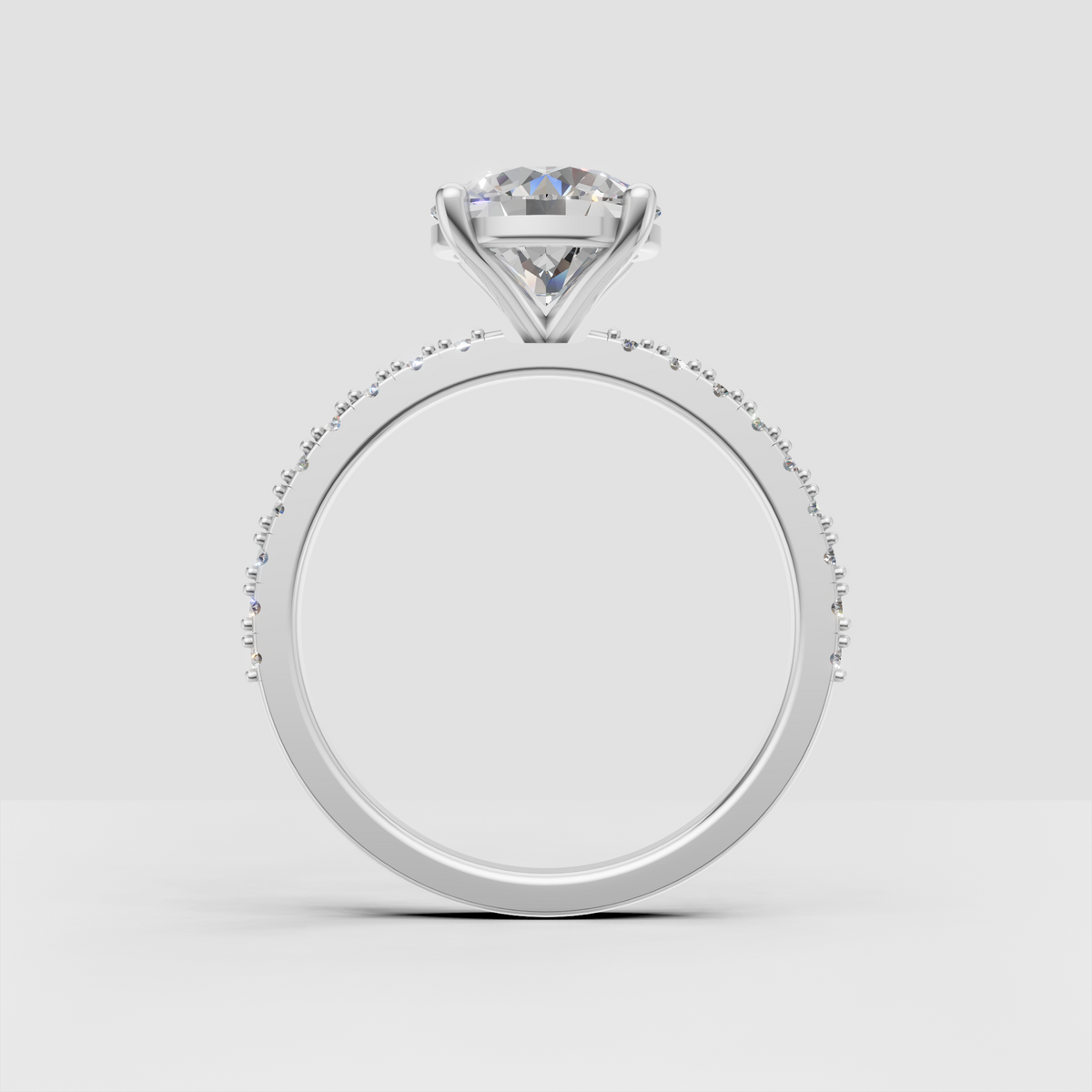 Round canter stone engagement ring with vintage pave detailing