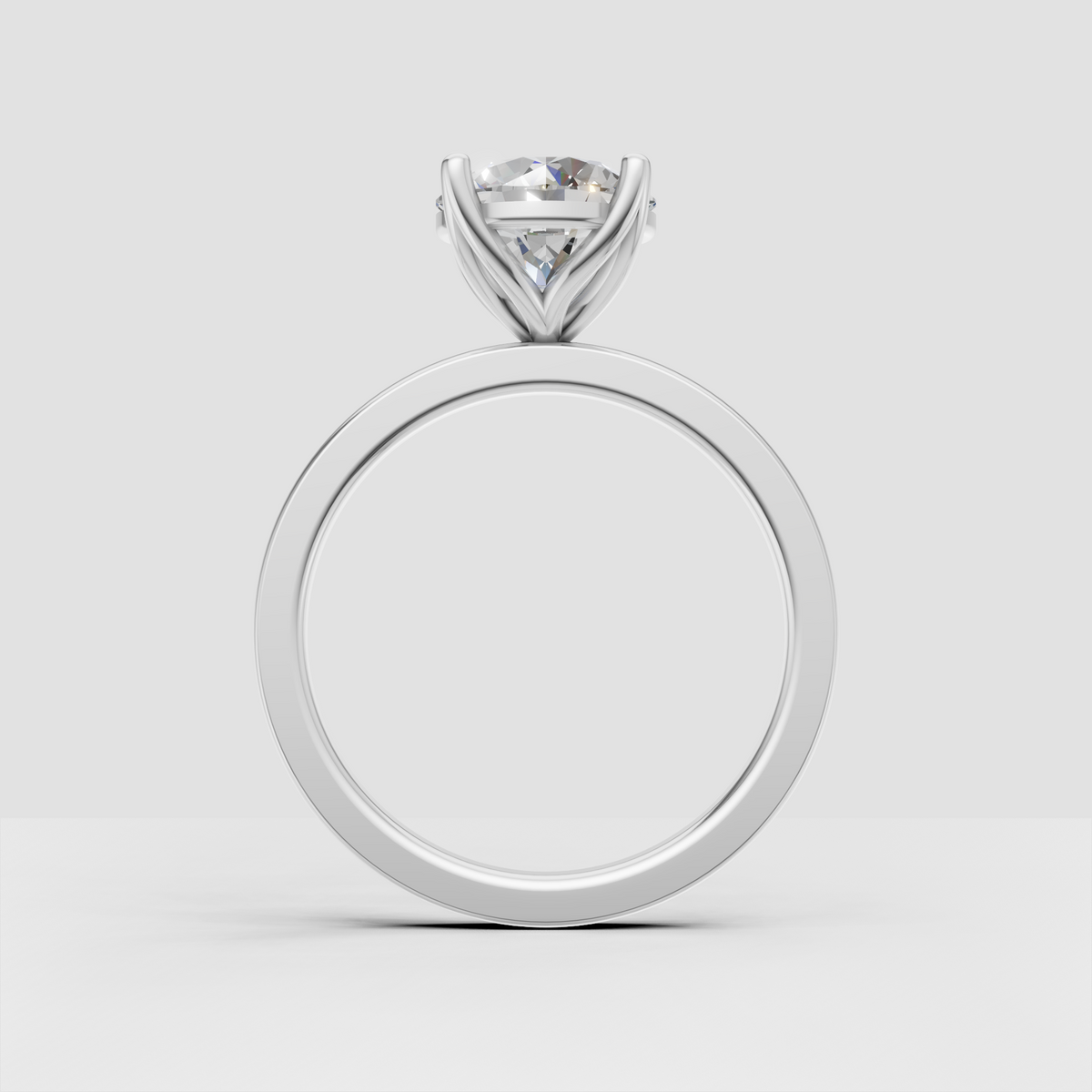 Round brilliant engagement ring with elevated four-prong setting