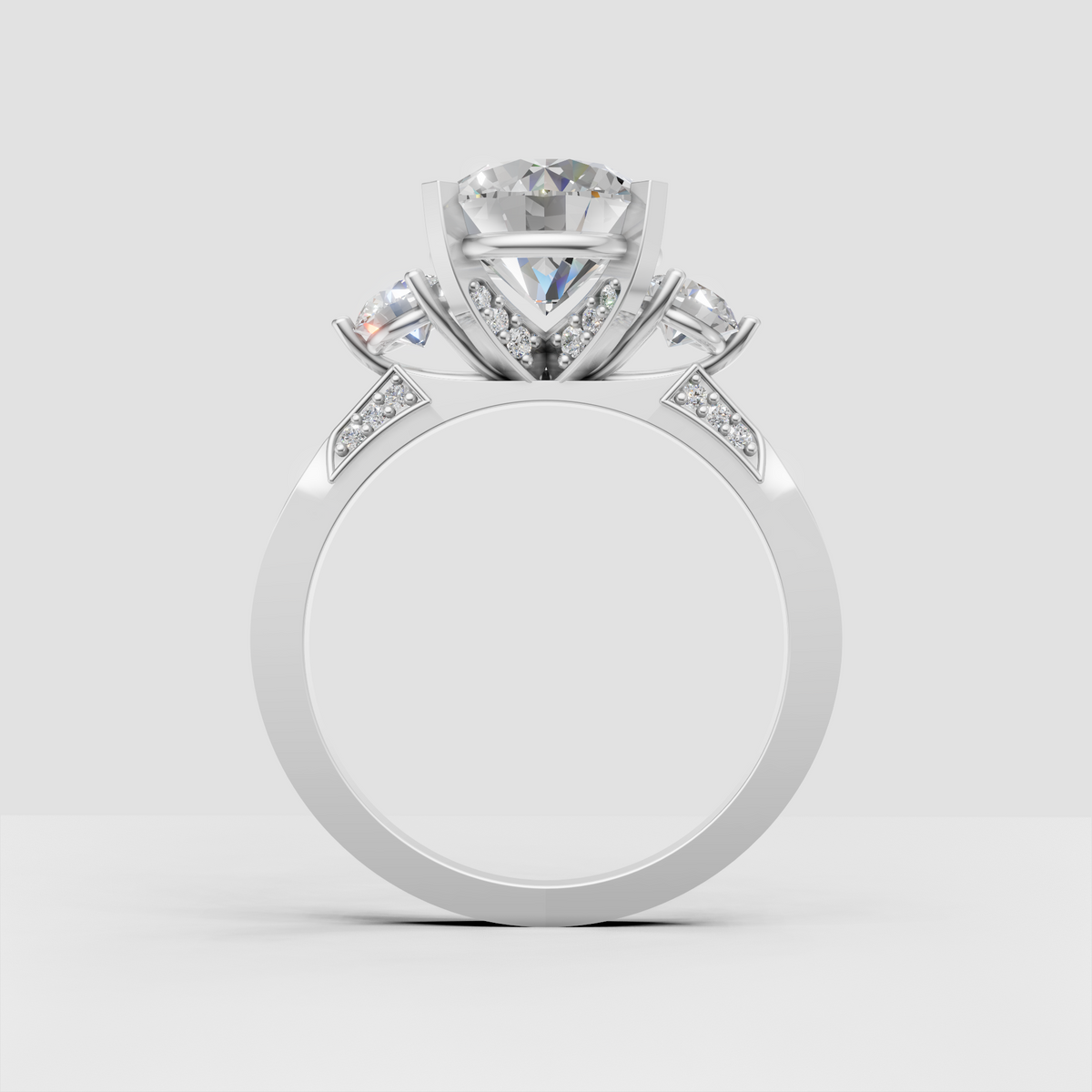 Three-stone diamond ring with pavé-set shoulder detailing