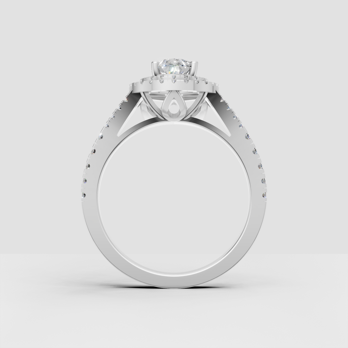 Pear canter diamond ring with triple halo design