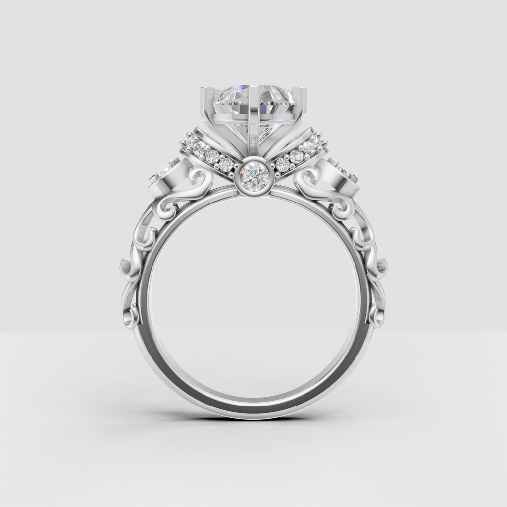 Pear diamond ring featuring vintage filigree scrollwork and milgrain details