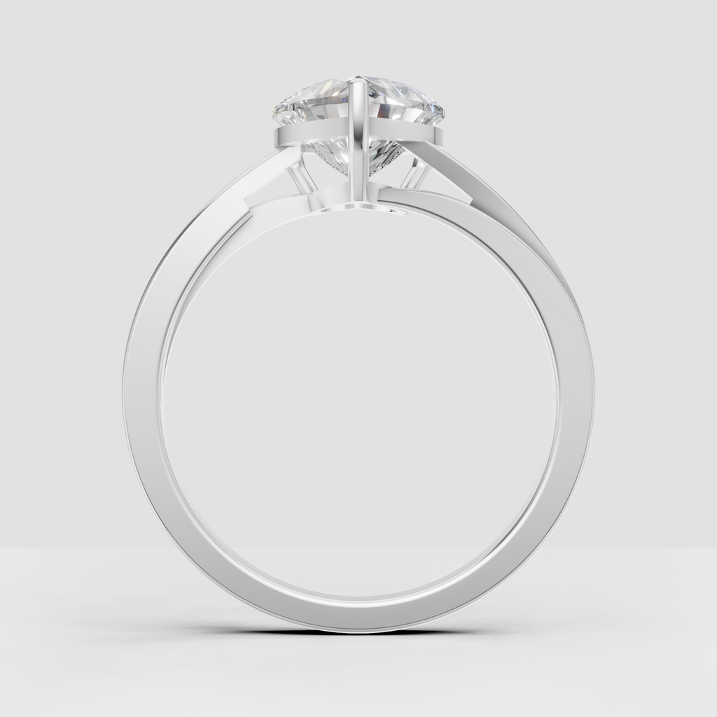 Heart cut solitaire ring showcasing sculpted yellow gold shoulders