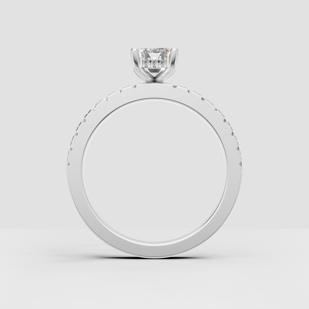 Yellow gold emerald cut engagement ring with four-prong elevated setting