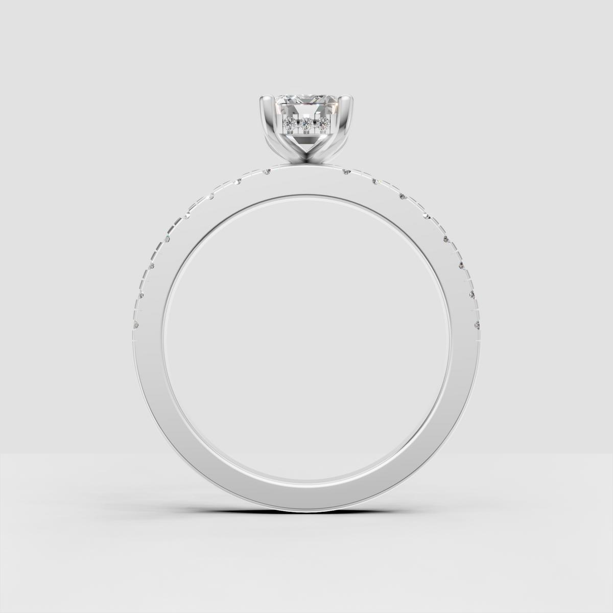 Yellow gold emerald cut engagement ring with four-prong elevated setting