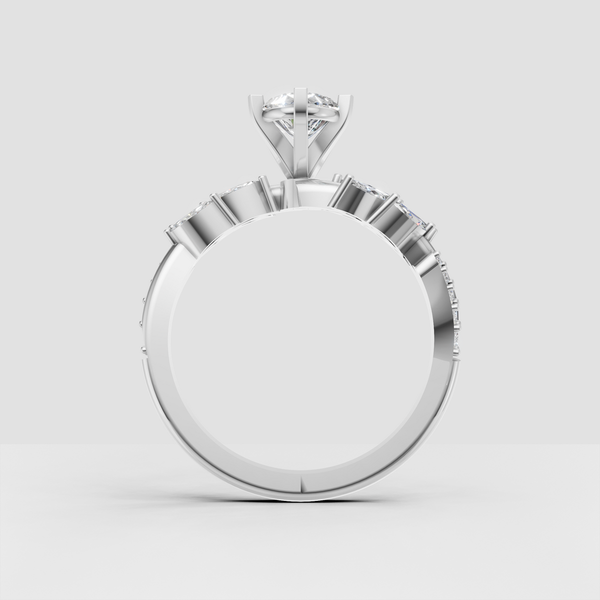 Nature inspired gold engagement ring with pear center stone