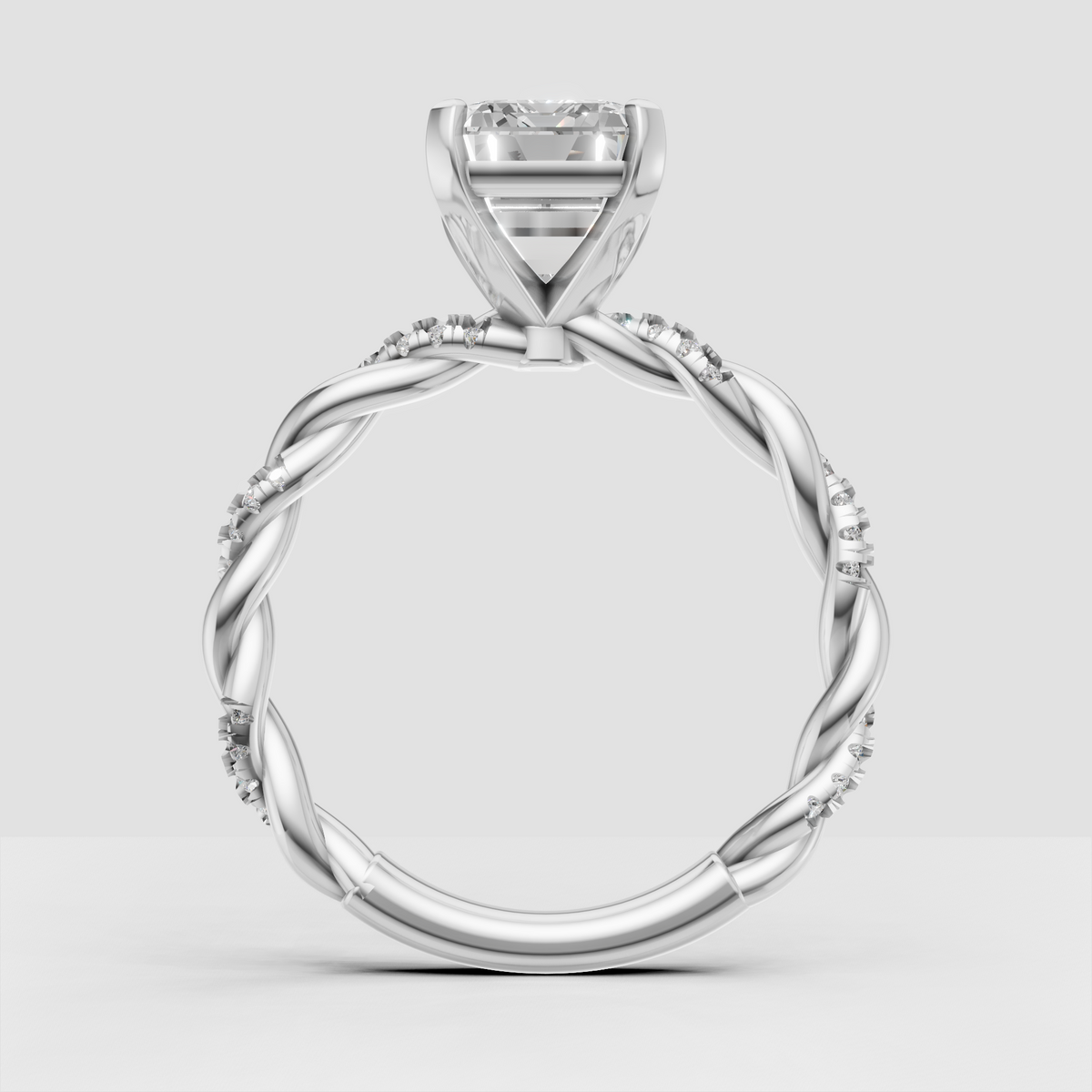 Emerald cut engagement ring with delicate round diamond accents