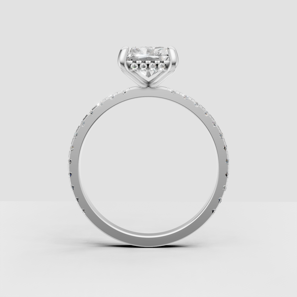 Close-up radiant diamond ring with detailed pave band