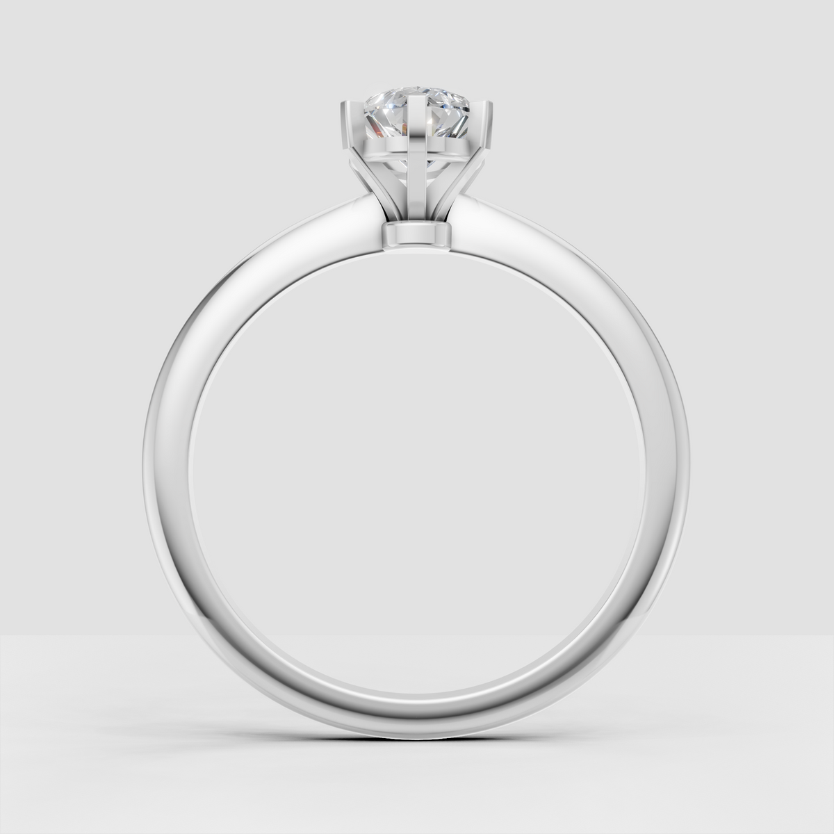 Pear diamond solitaire ring with elevated cathedral-style shoulders