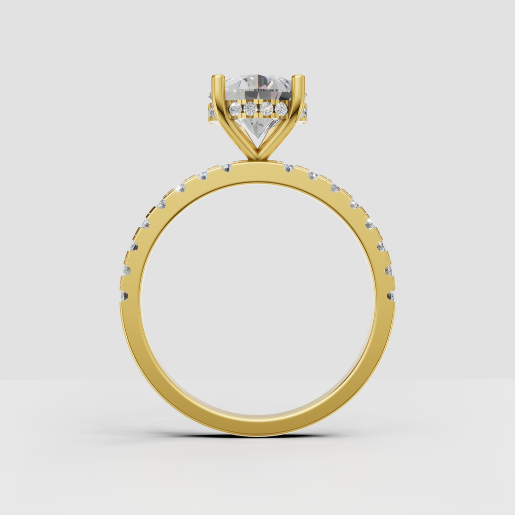 Yellow gold pear diamond ring with delicate pavé band