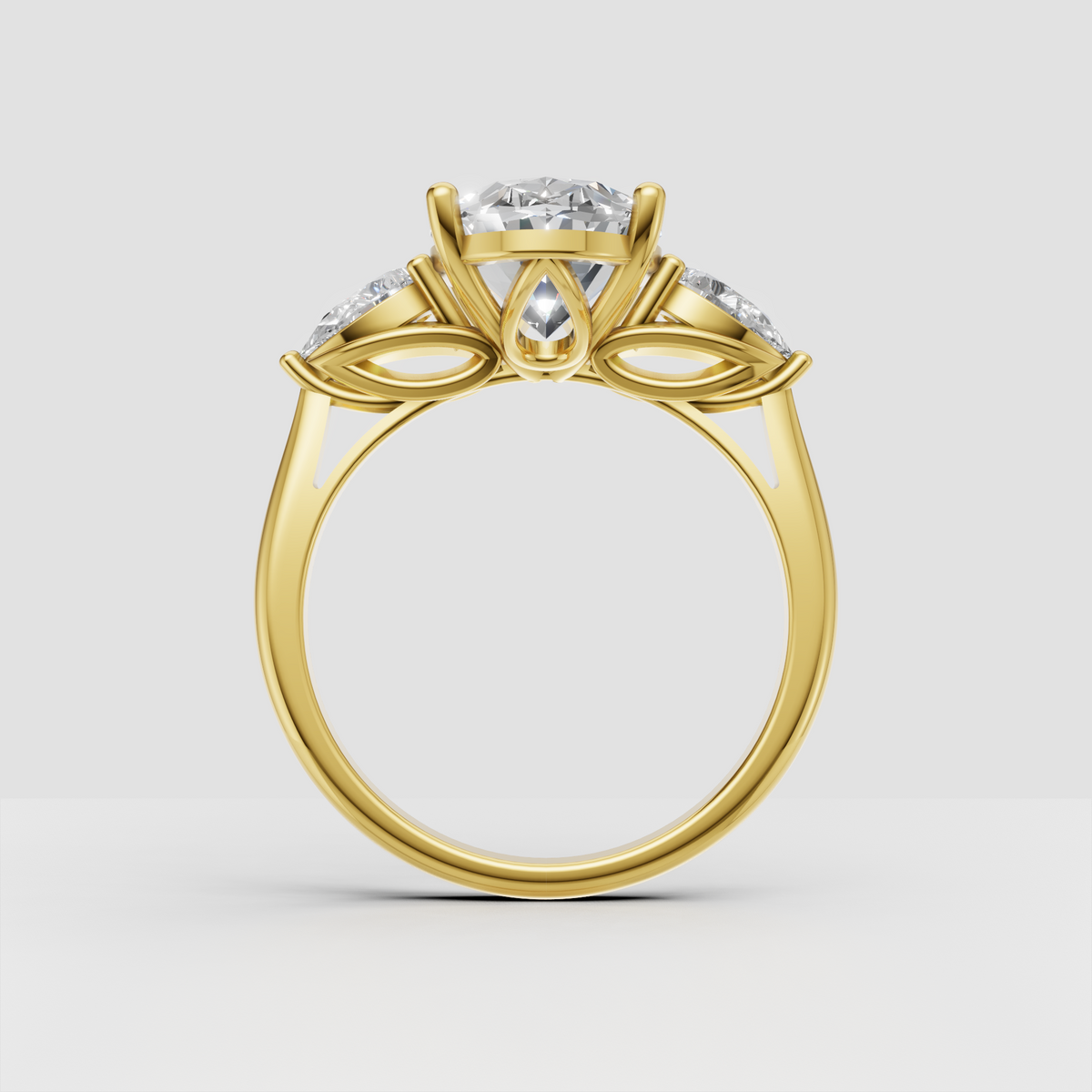 Oval diamond three-stone ring with elegant leaf-inspired setting details