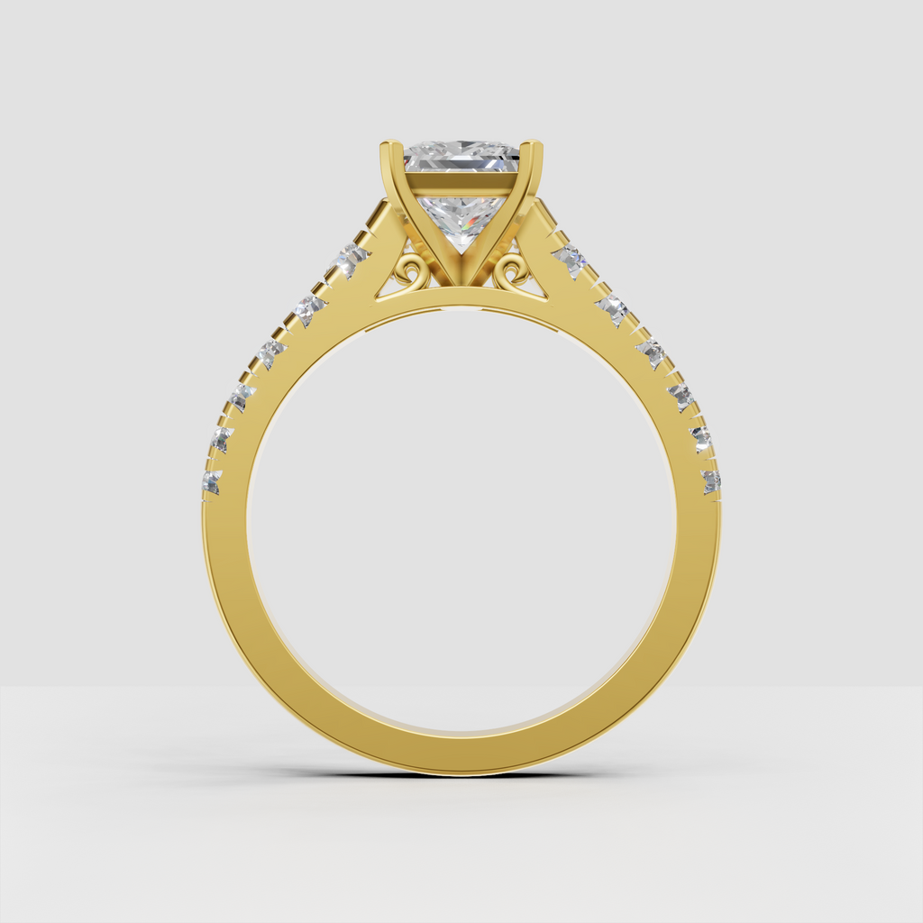 Yellow gold engagement ring featuring princess cut center stone
