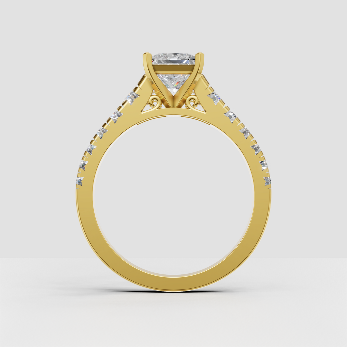 Yellow gold engagement ring featuring princess cut center stone