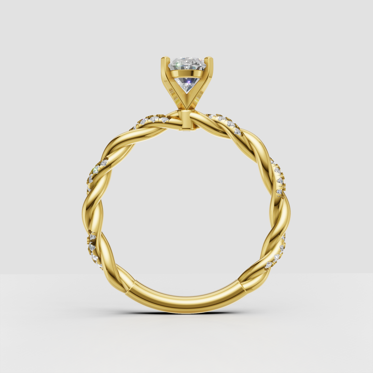 Twisted yellow gold oval diamond engagement ring