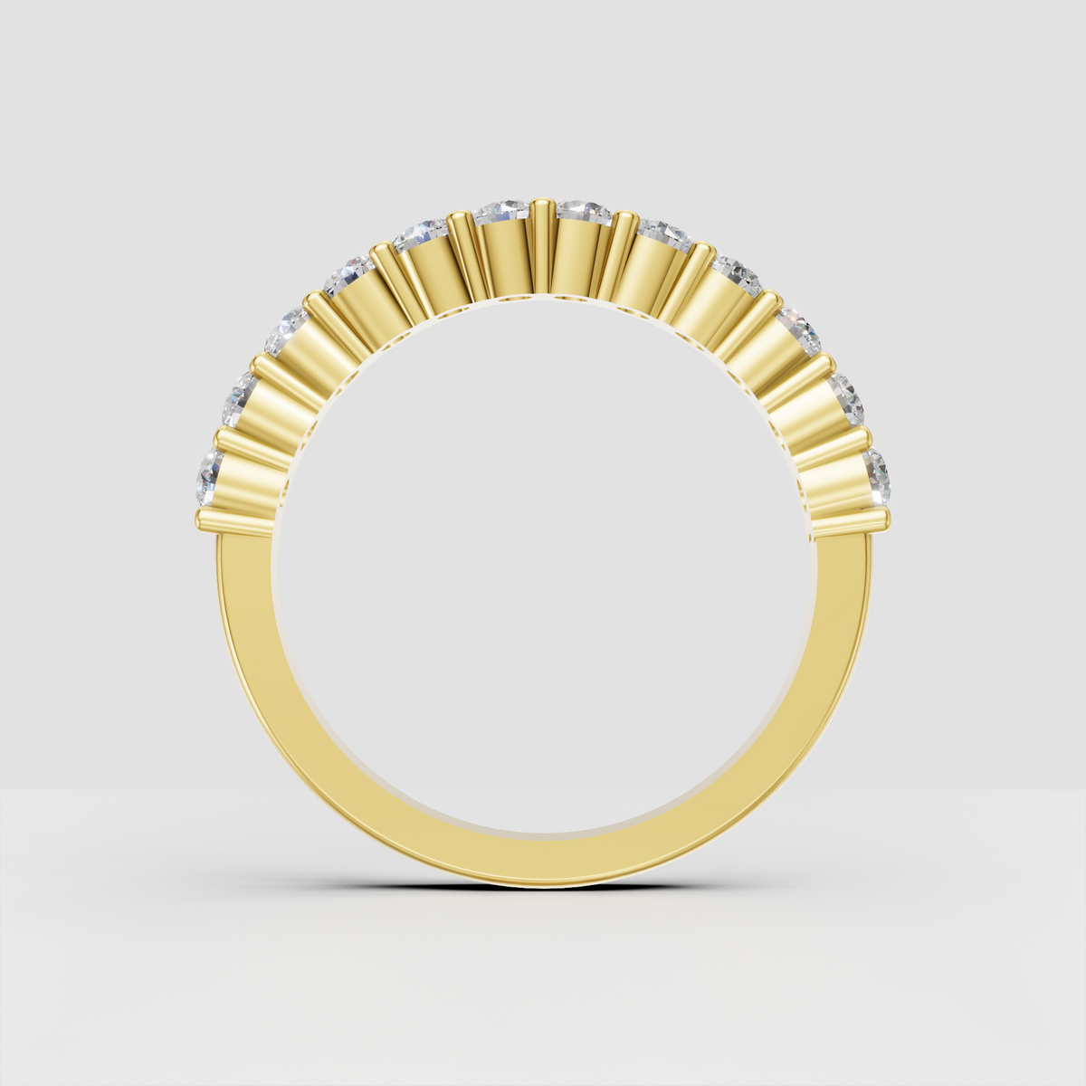 Round diamond wedding band in yellow gold with closely spaced sparkling stones