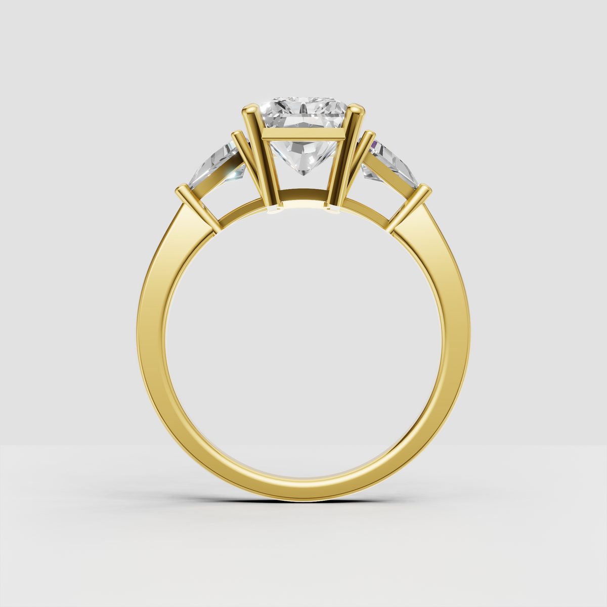 Radiant cut diamond ring featuring two trillion-shaped accent stones