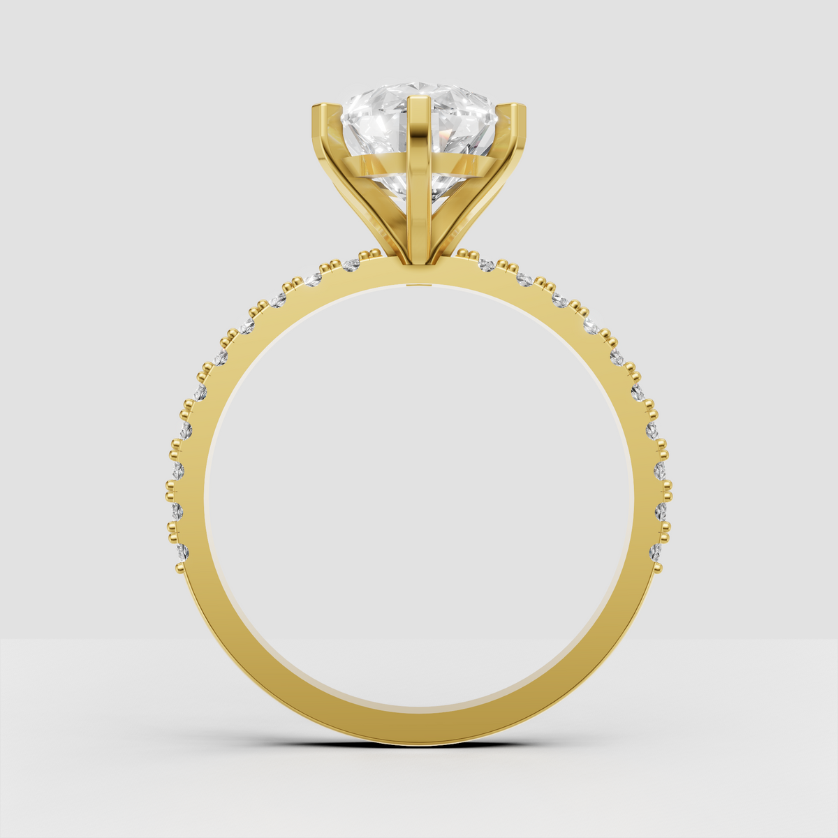 Pear-shaped center stone ring with six-prong yellow gold setting
