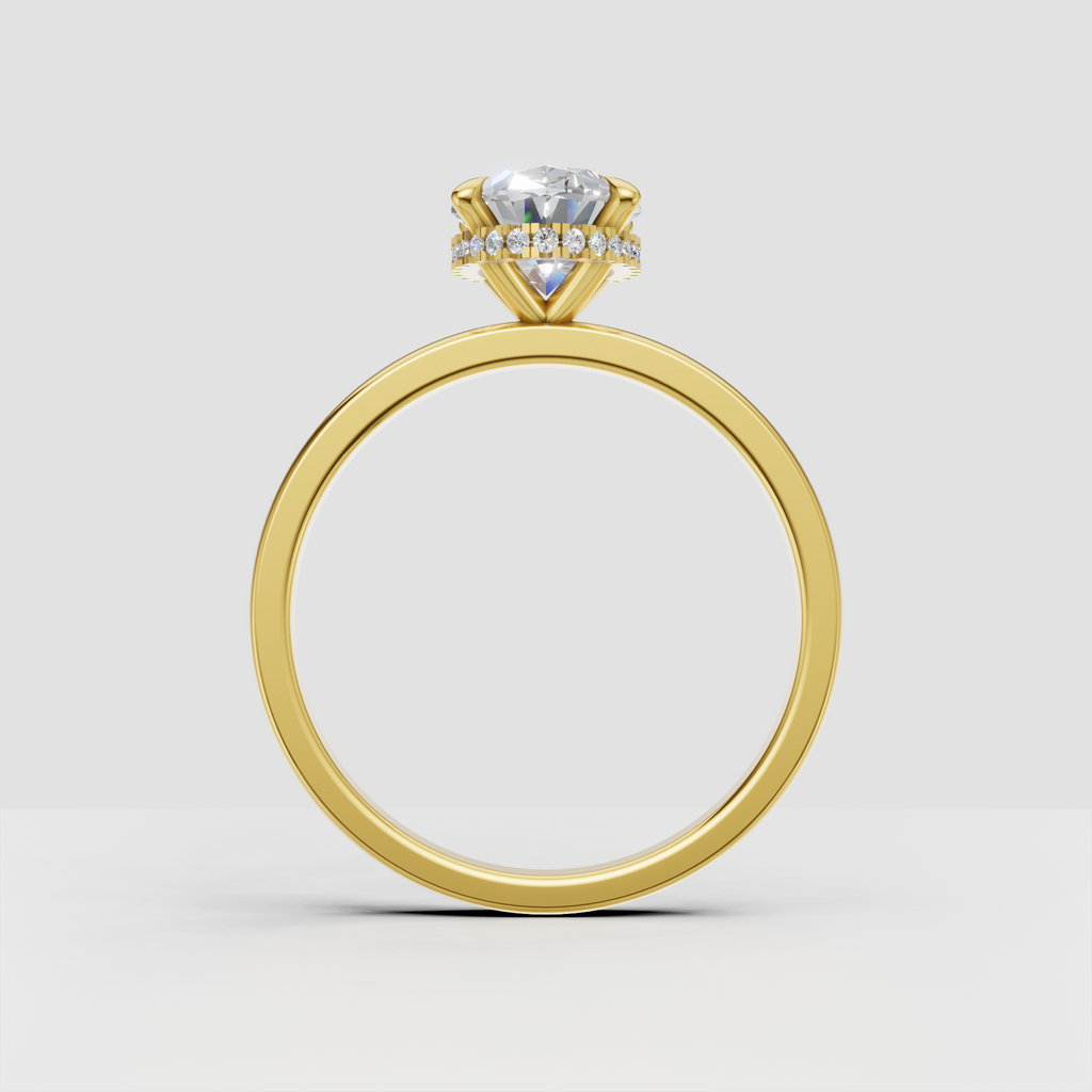 Oval diamond ring with discreet hidden halo beneath center stone
