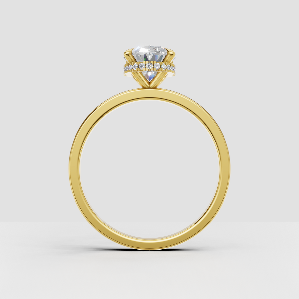 Oval diamond ring with discreet hidden halo beneath center stone