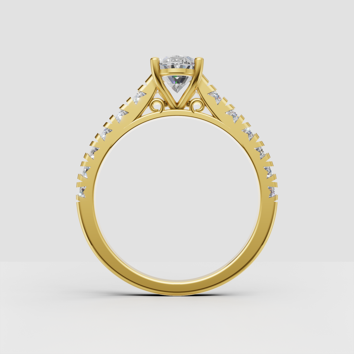 Oval diamond ring featuring four rounded prongs and side stones