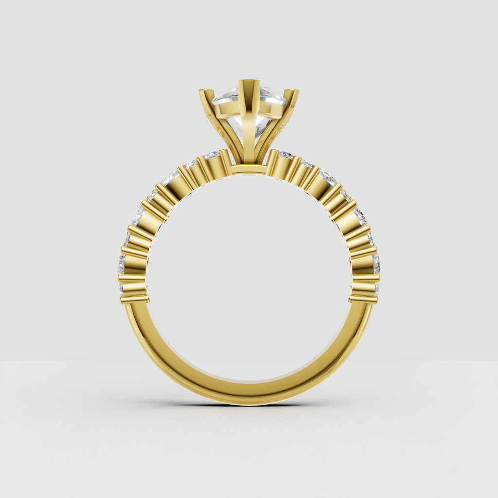 Yellow gold marquise solitaire engagement ring with detailed diamond shoulders
