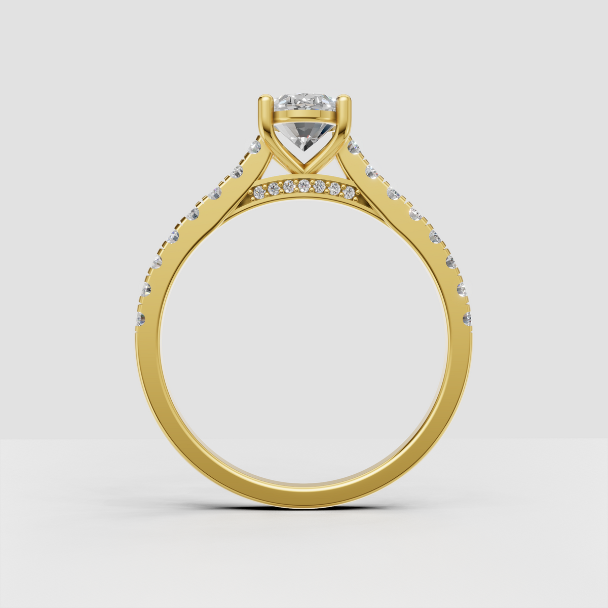 Yellow gold oval diamond ring with diamond shoulders