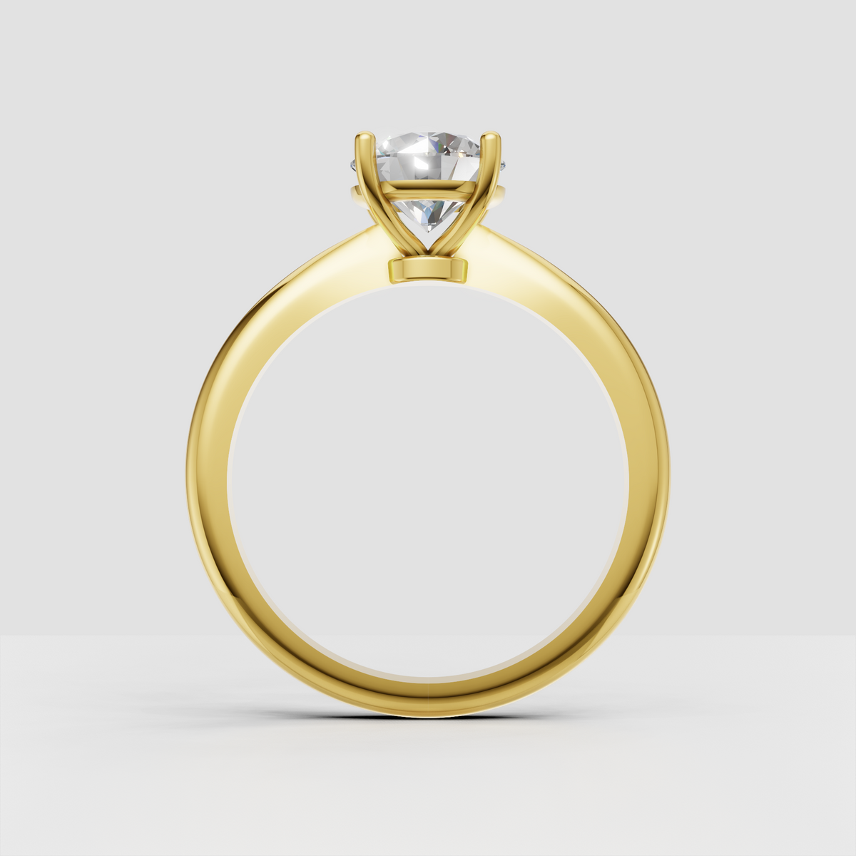 Yellow gold round diamond solitaire engagement ring viewed from the front