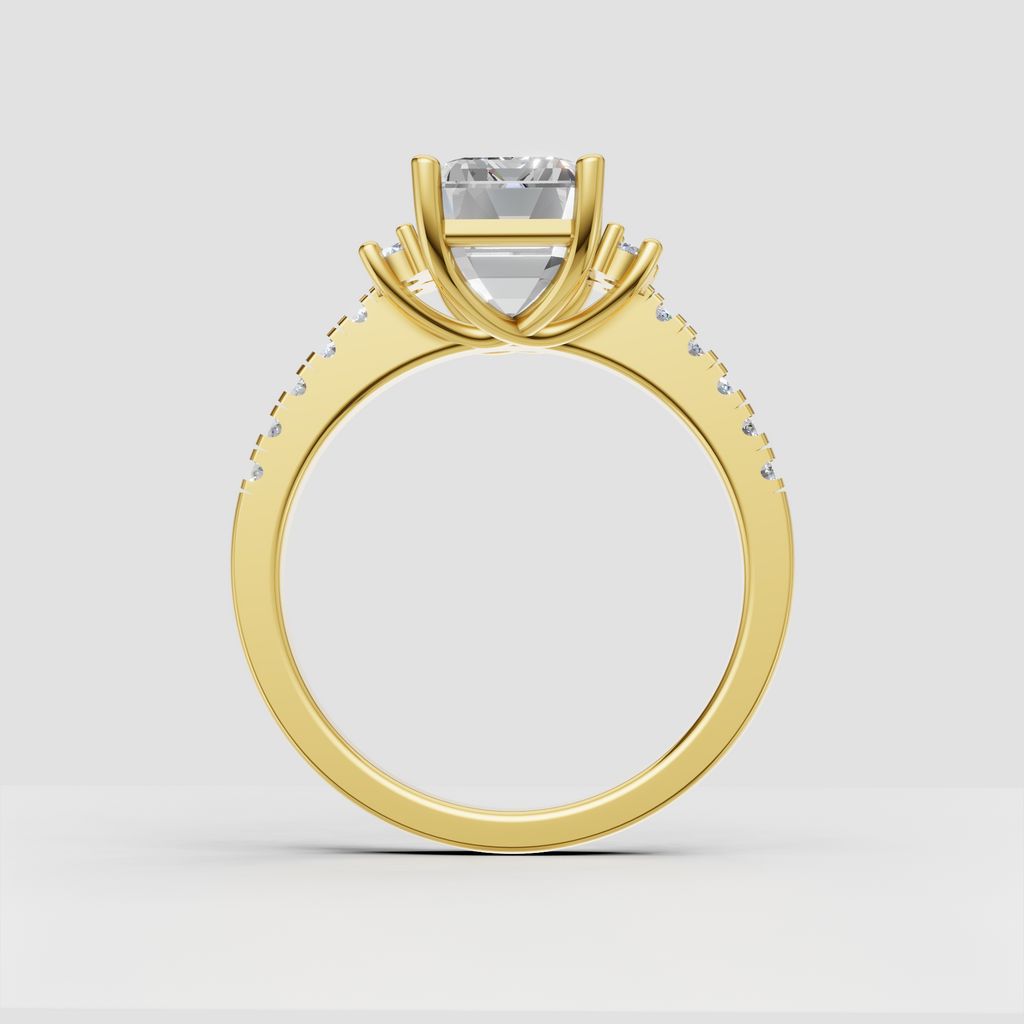 Emerald cut diamond ring with symmetrical round diamond clusters