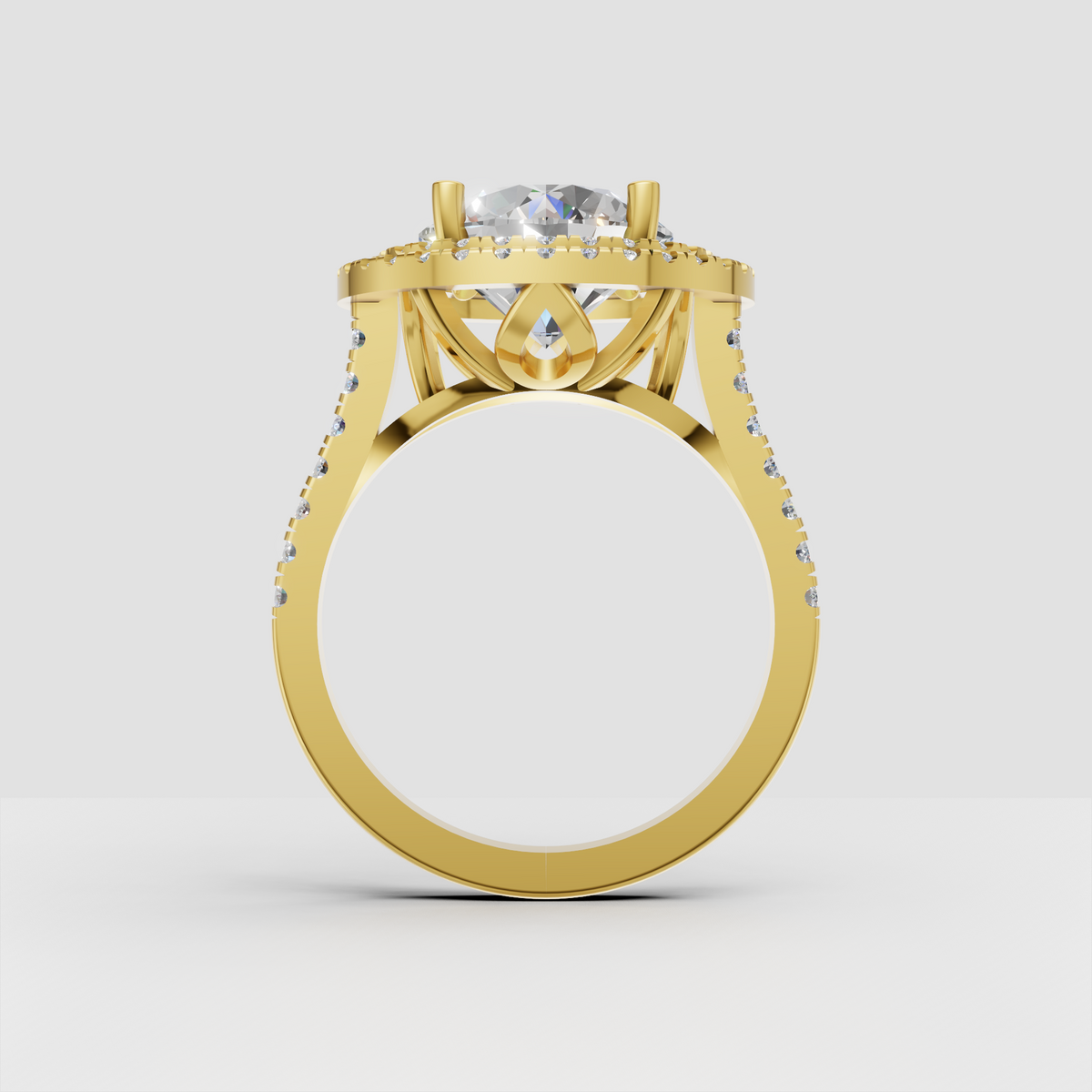 Round diamond halo ring with four-prong center setting and pavé shoulders