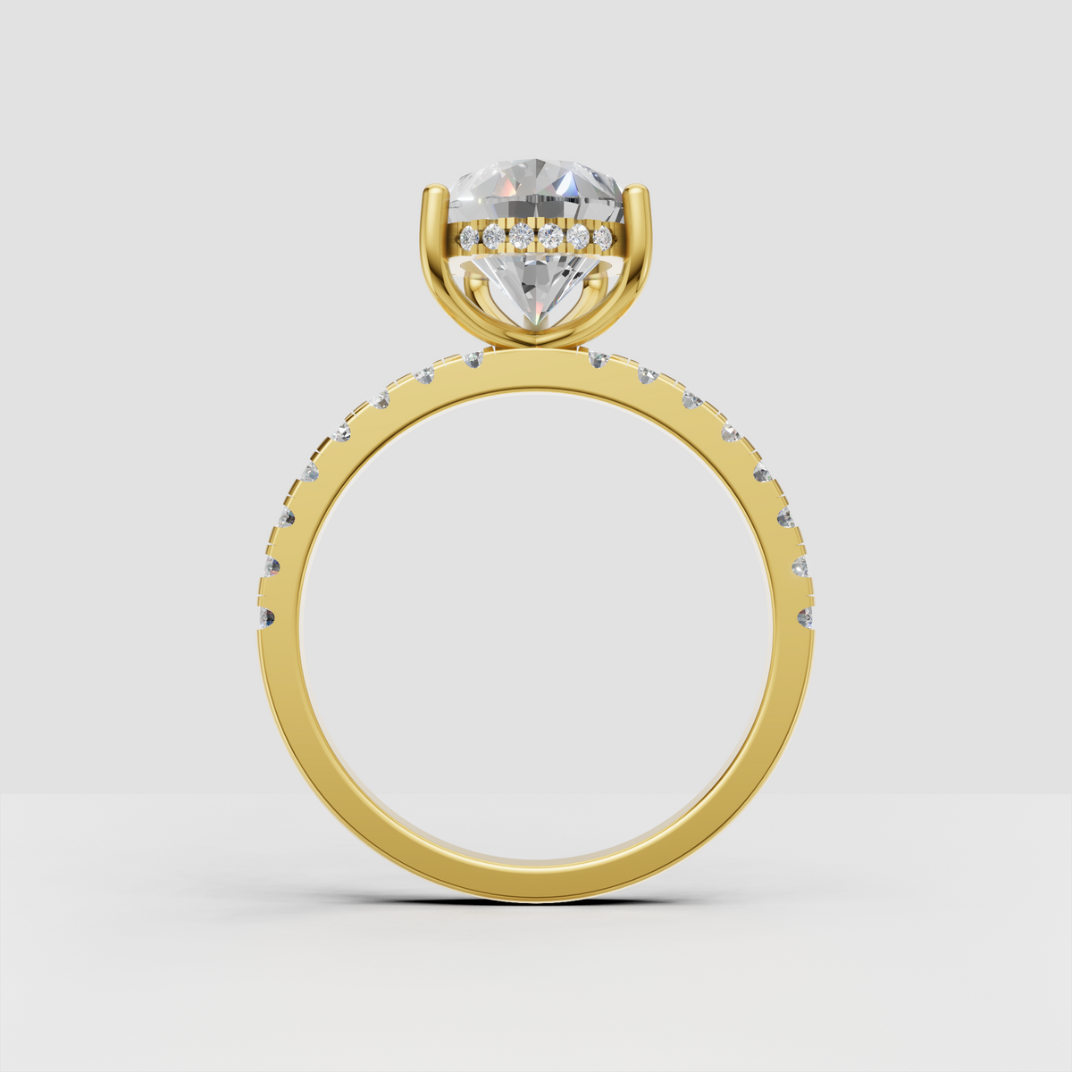 Pear cut engagement ring with hidden halo setting