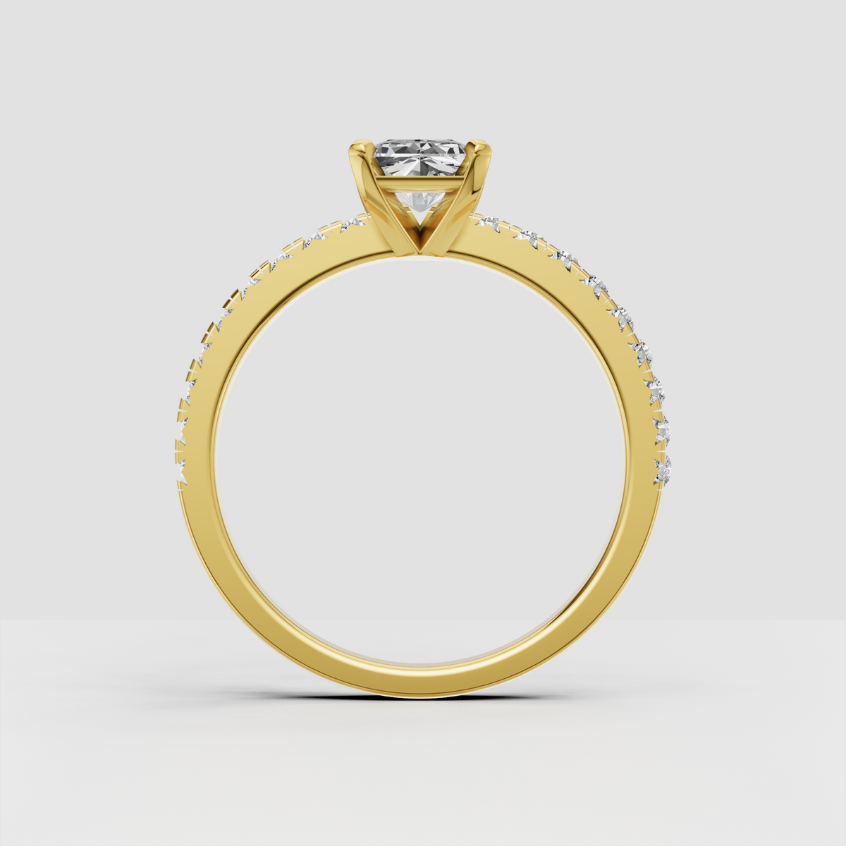 Yellow gold radiant Diamond engagement ring featuring a sparkling pavé band