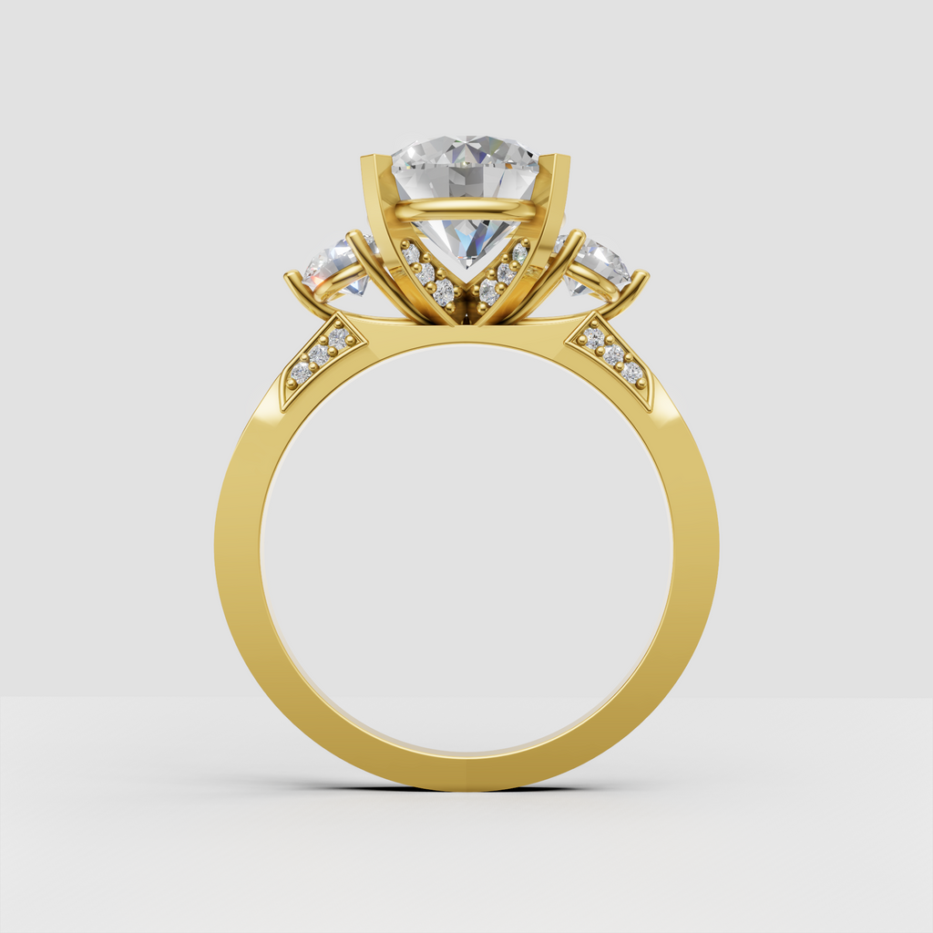 Yellow gold three-stone engagement ring with pavé accents