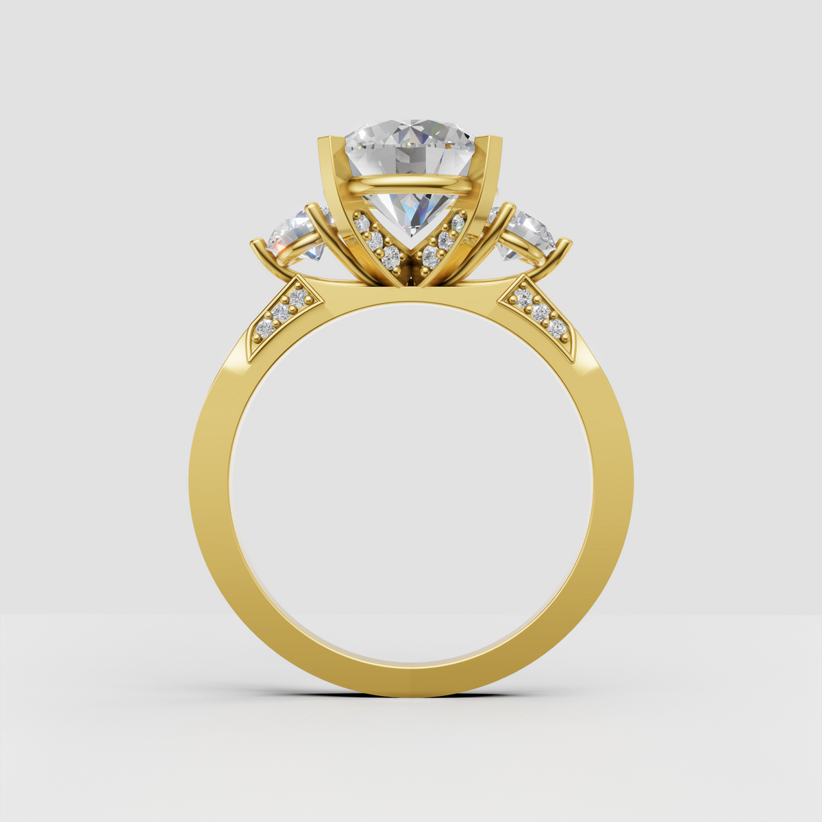 Yellow gold three-stone engagement ring with pavé accents