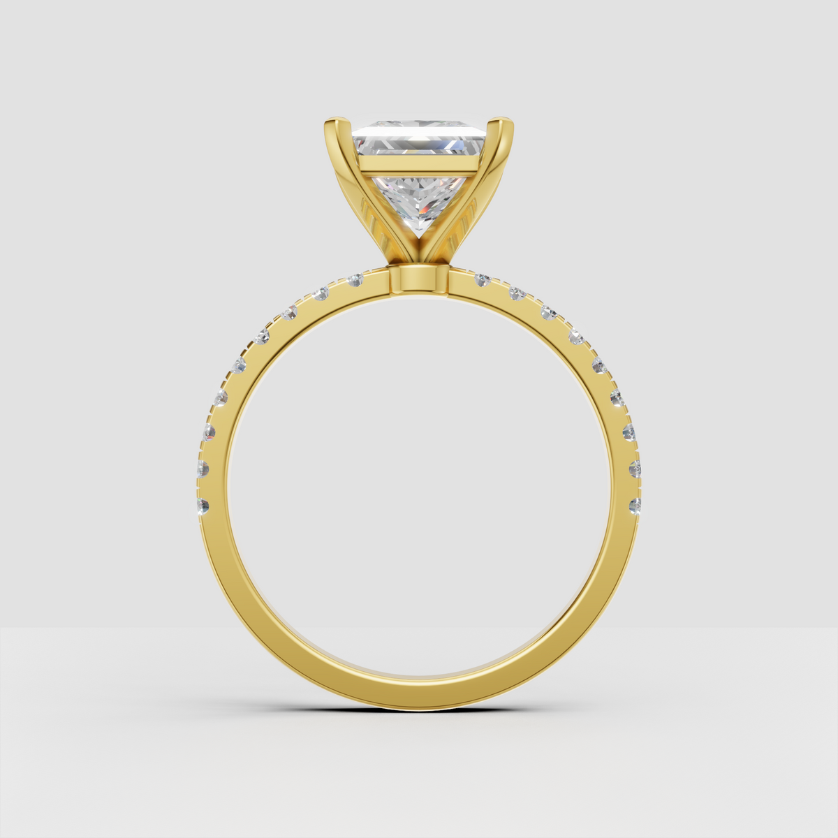 Princess cut center diamond ring with four corner prongs and accent diamonds