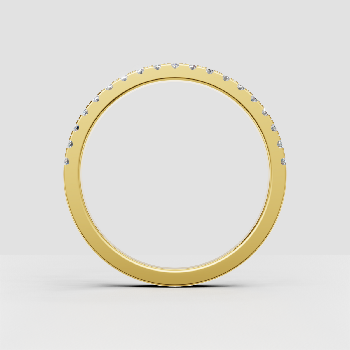 Round diamond channel set band with smooth polished gold finish