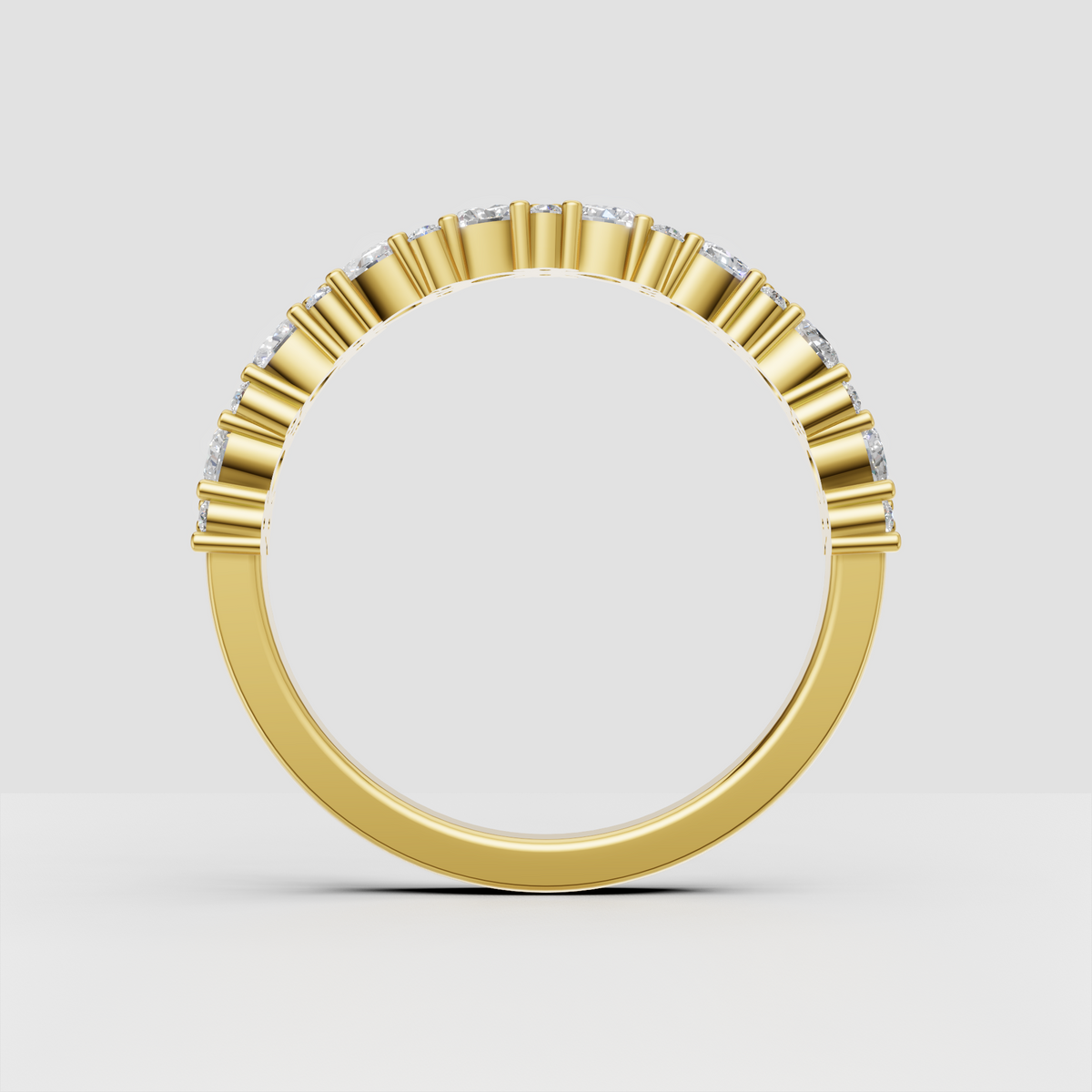 Round and pear cut diamond half eternity ring viewed from the front